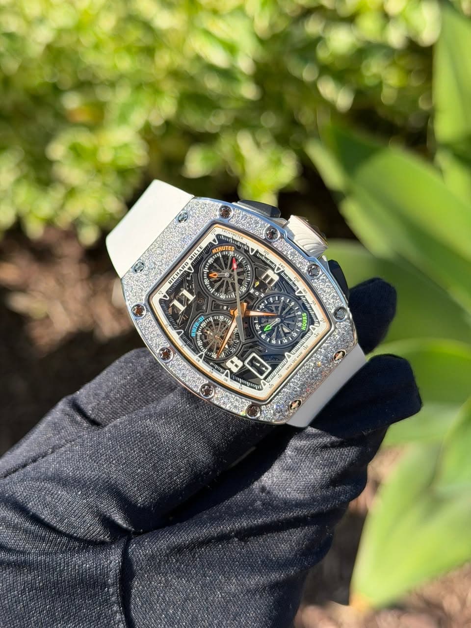 May be an image of wrist watch and text