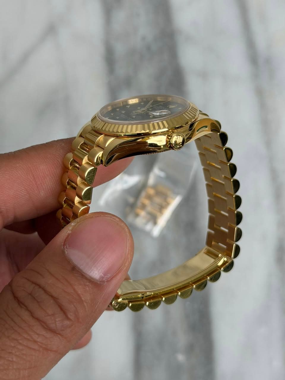 May be an image of jewelry and wrist watch