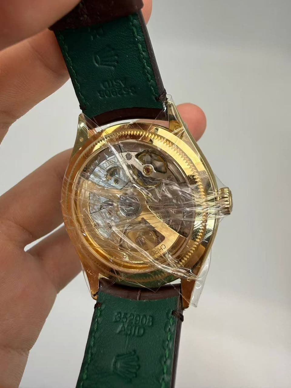 May be an image of wrist watch and text