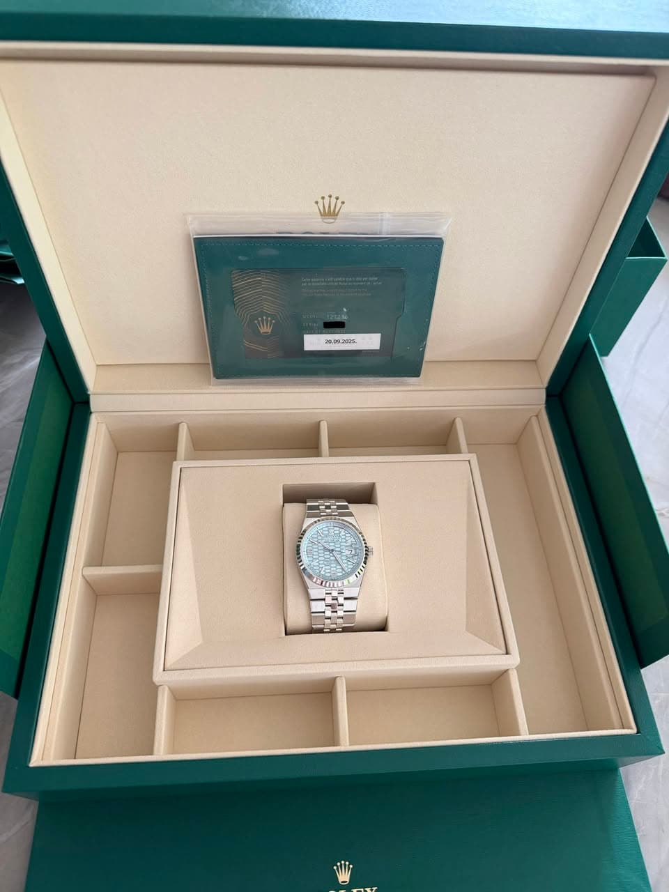May be an image of wrist watch and text