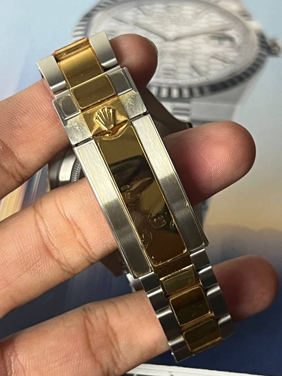 May be an image of wrist watch and text