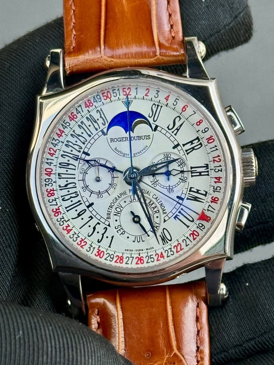 May be an image of wrist watch and text