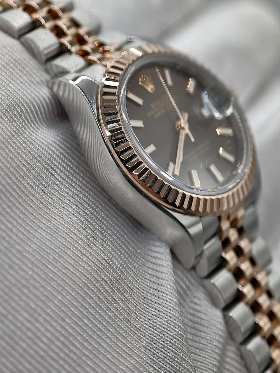 May be an image of wrist watch and text