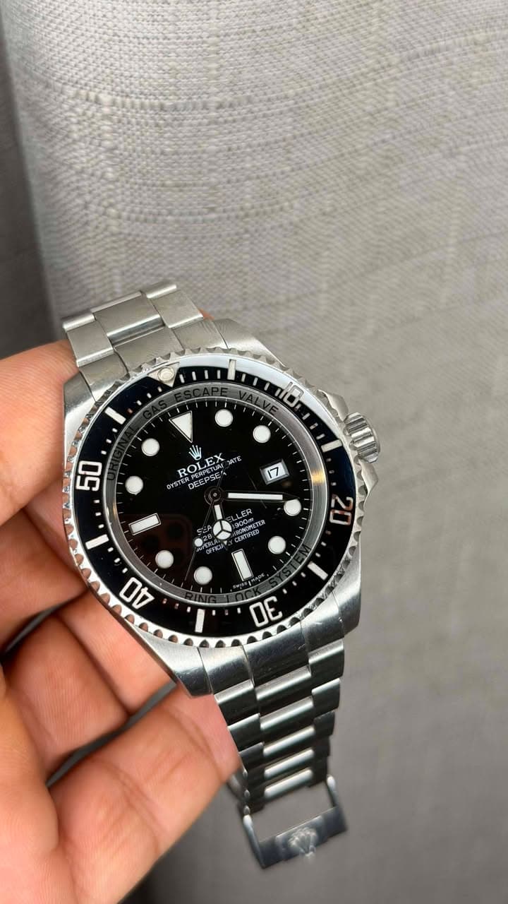 May be an image of wrist watch and text