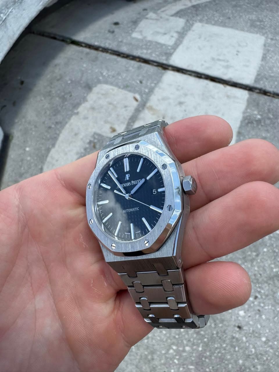 May be an image of wrist watch and text