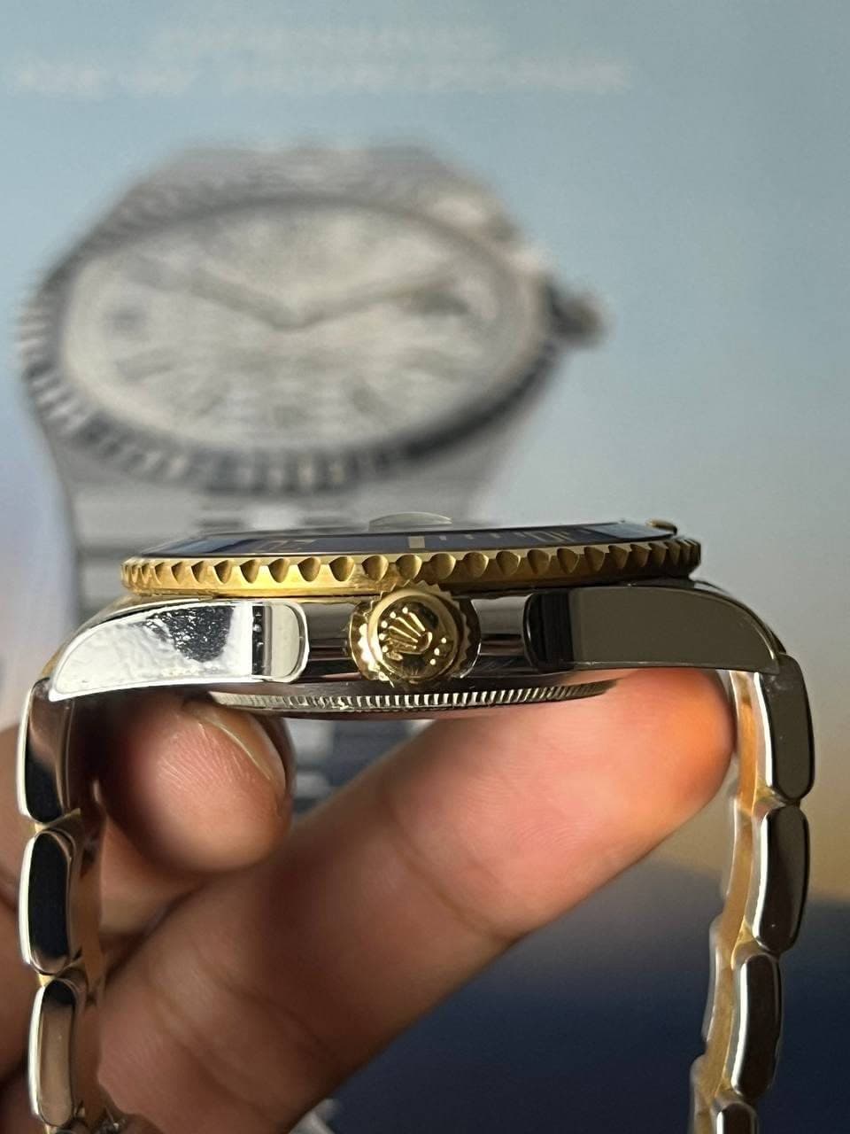 May be an image of wrist watch and text