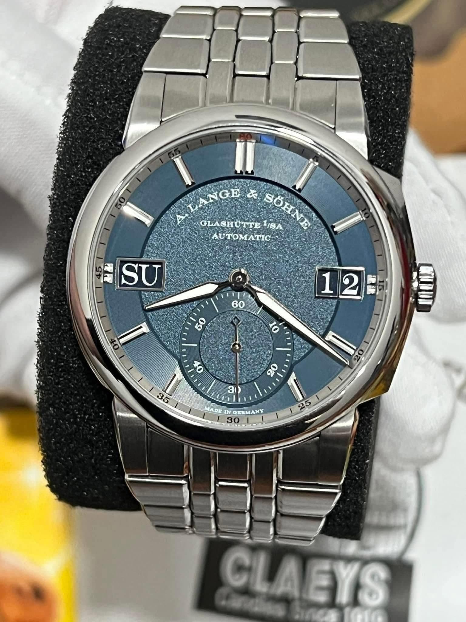 May be an image of wrist watch and text