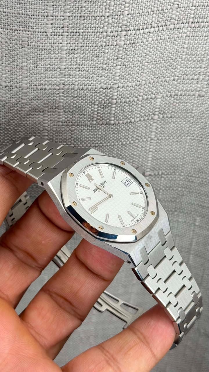 May be an image of wrist watch and text