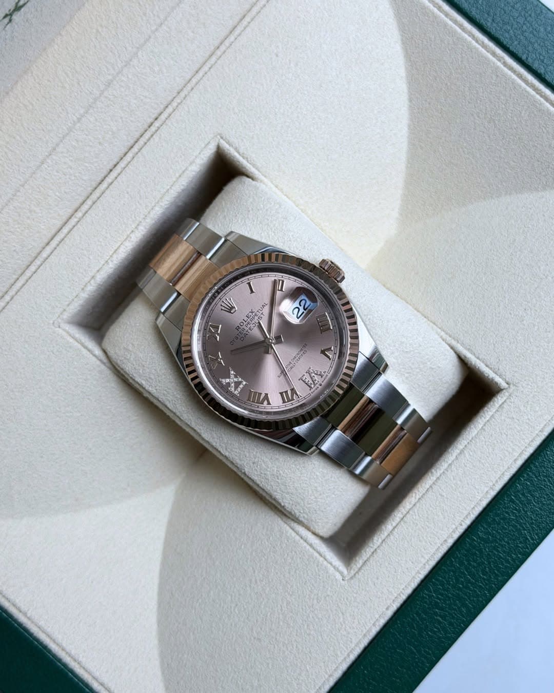 May be an image of wrist watch and text