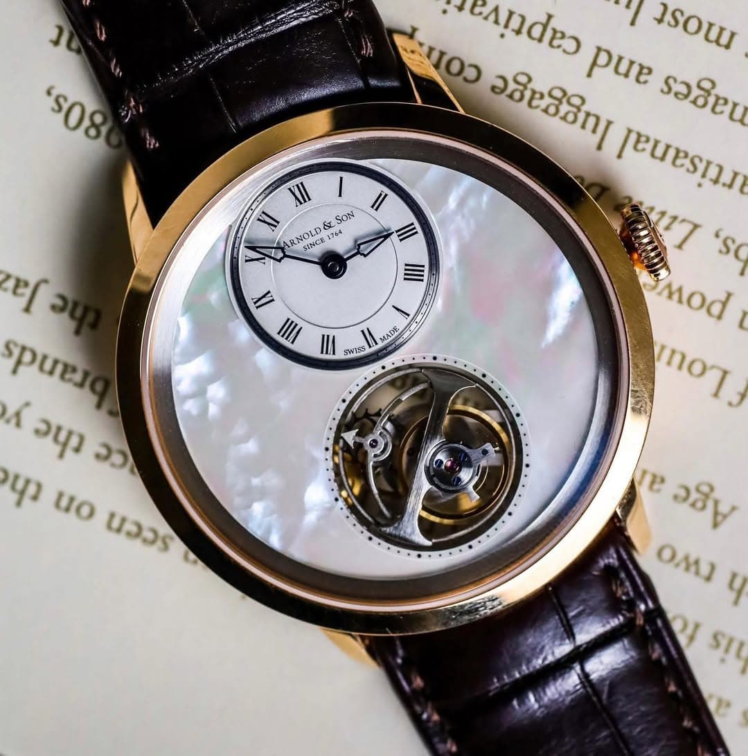 May be an image of wrist watch and text