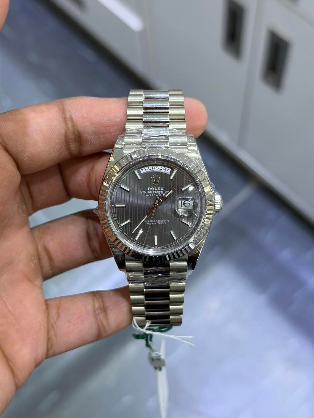 May be an image of wrist watch and text