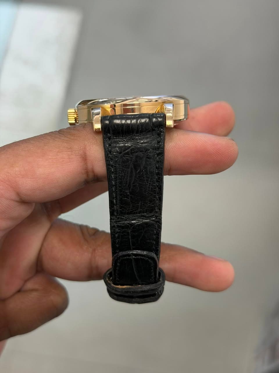 May be an image of wrist watch and text