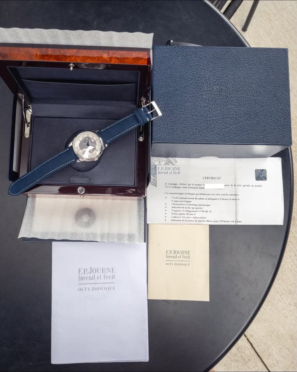 May be an image of wrist watch, saddle-stitched leather and text
