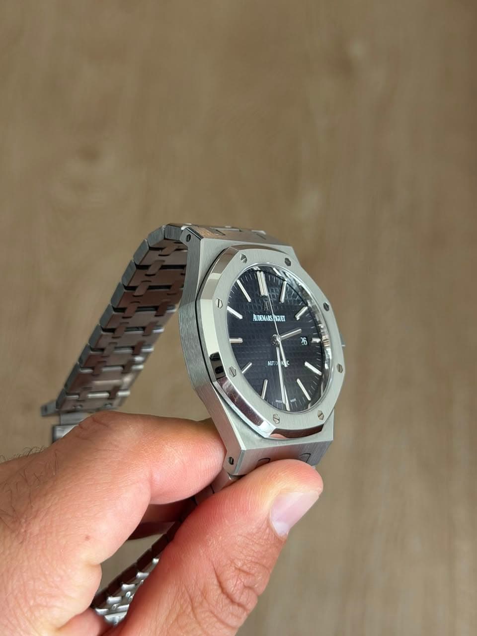 May be an image of wrist watch and text