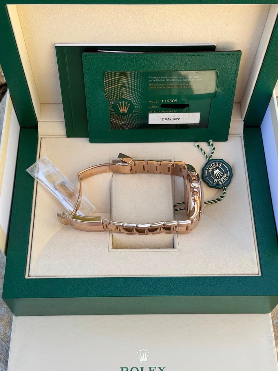May be an image of jewelry, wrist watch and text