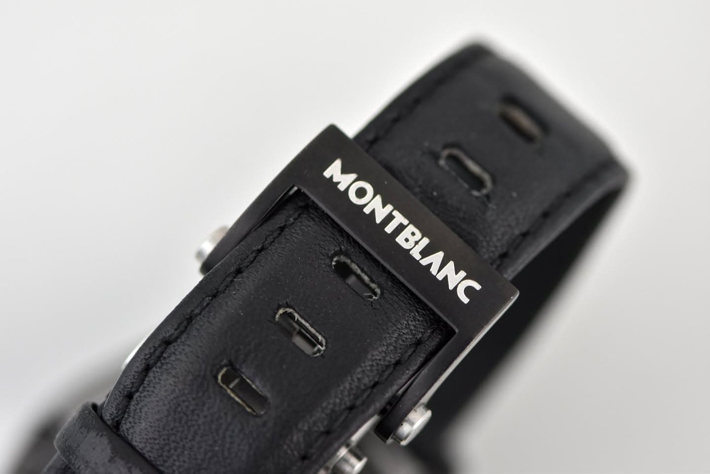 May be an image of leather, wrist watch and text