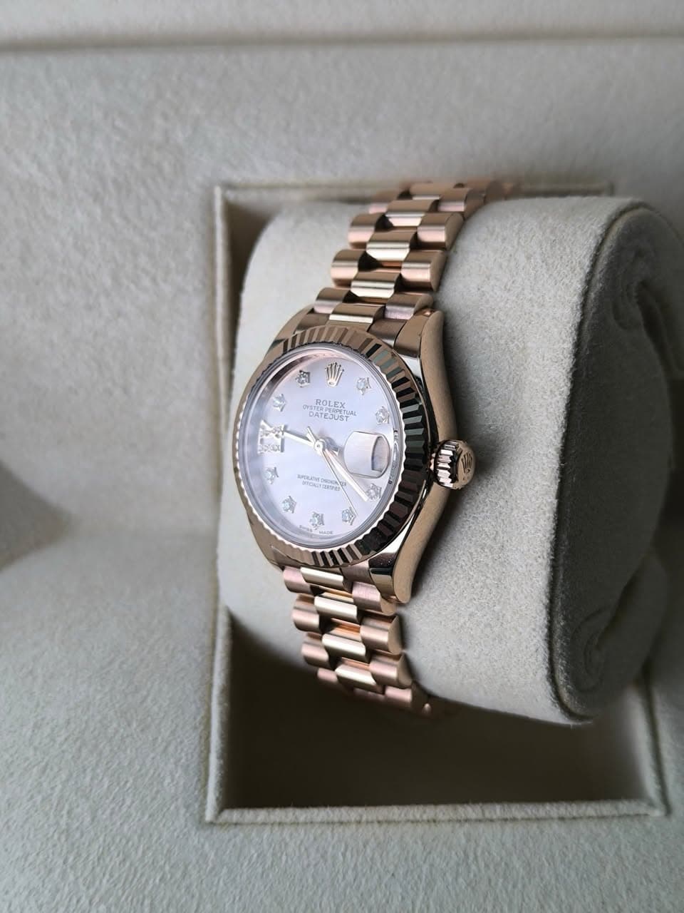 May be an image of wrist watch and text