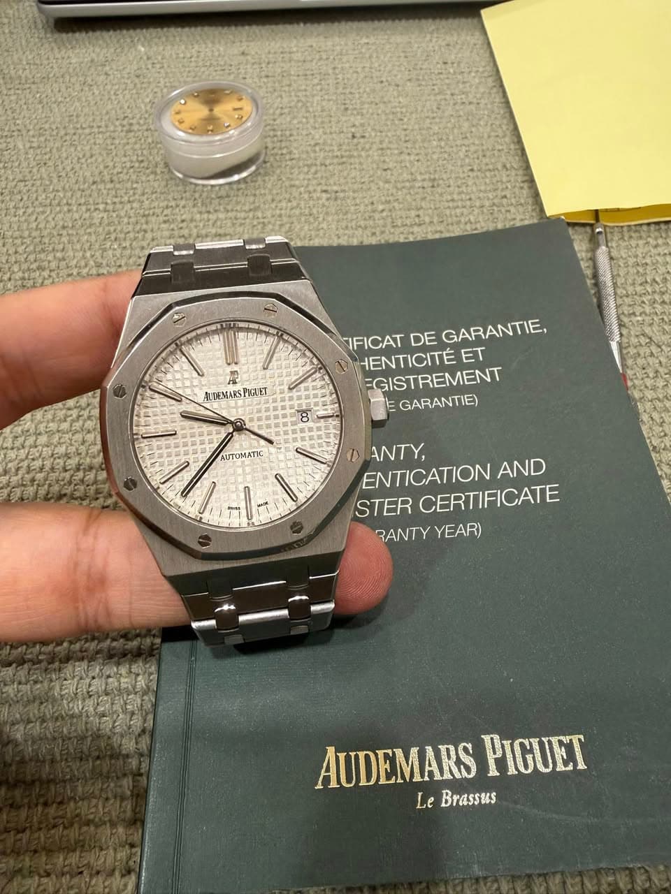 May be an image of wrist watch and text