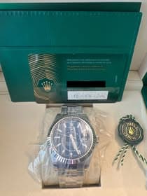 May be an image of wrist watch and text
