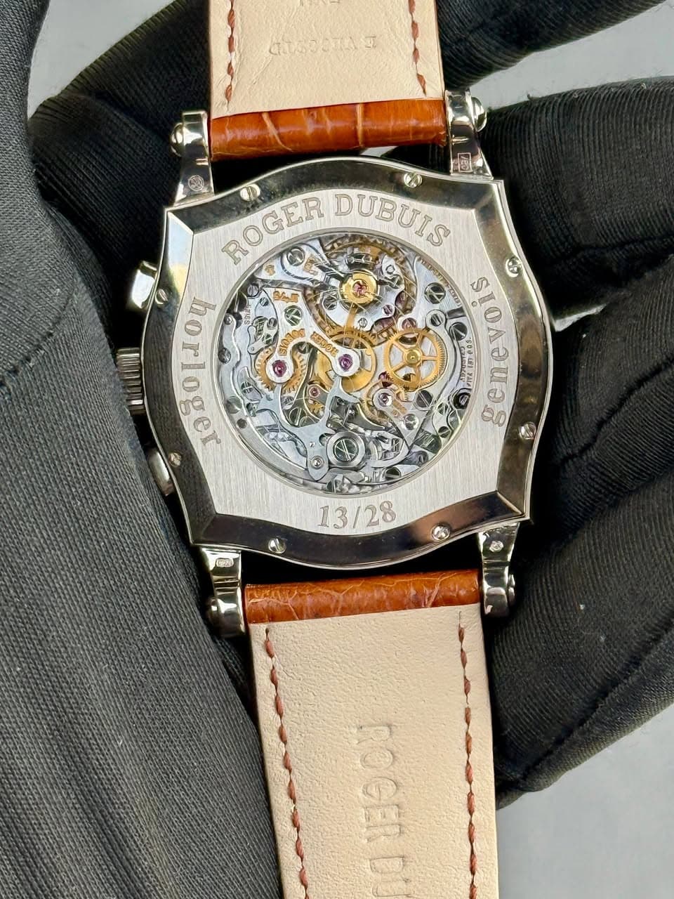 May be an image of wrist watch and text