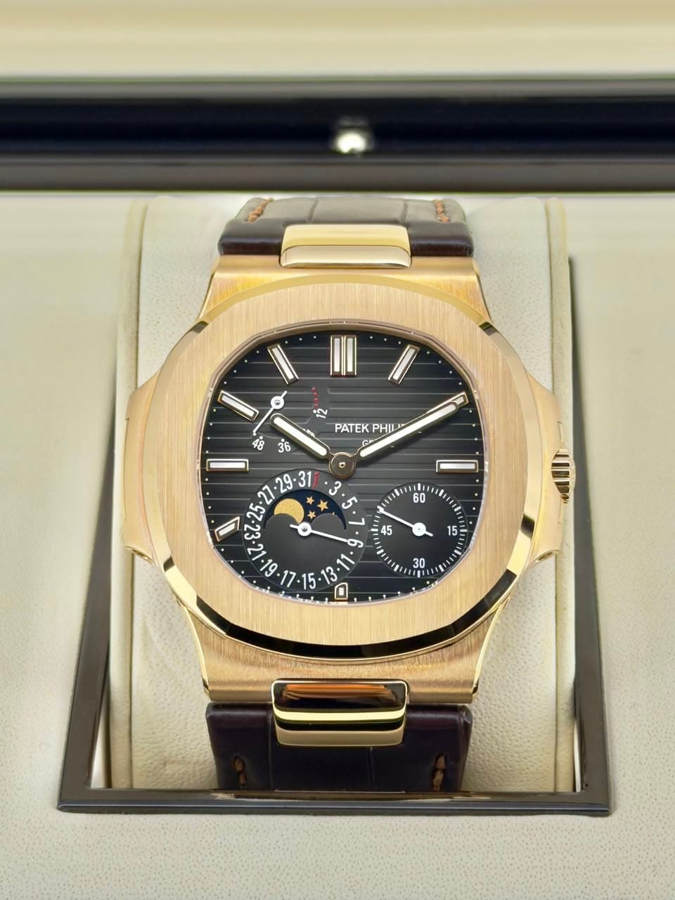 May be an image of wrist watch and text