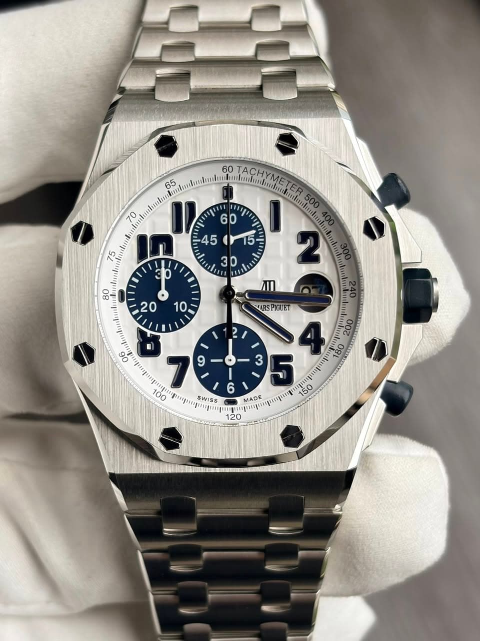 May be an image of wrist watch and text
