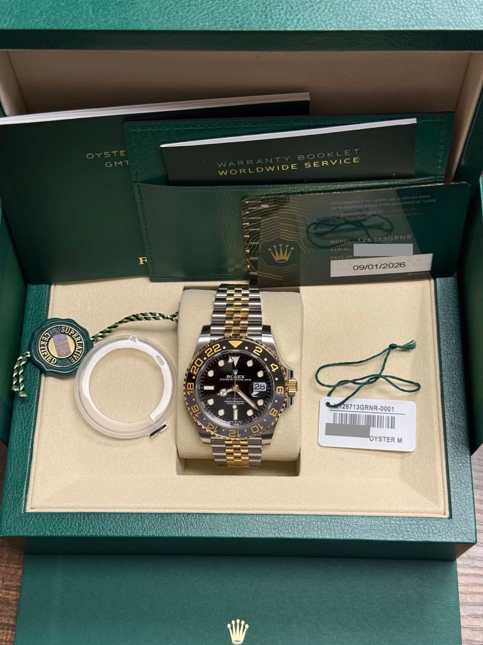May be an image of wrist watch and text that says 'WOLDWDESERVICE WORLDWIDE WOR WIDE SERVICE 09/01/2026 /2026 09/ ល میر 2 Q 6 umI C 12871 28713GRNR-000 13GRNR- -0001 TATNIINN…