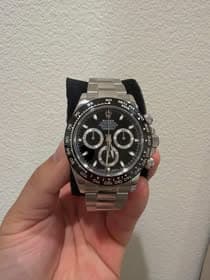 May be an image of wrist watch and text