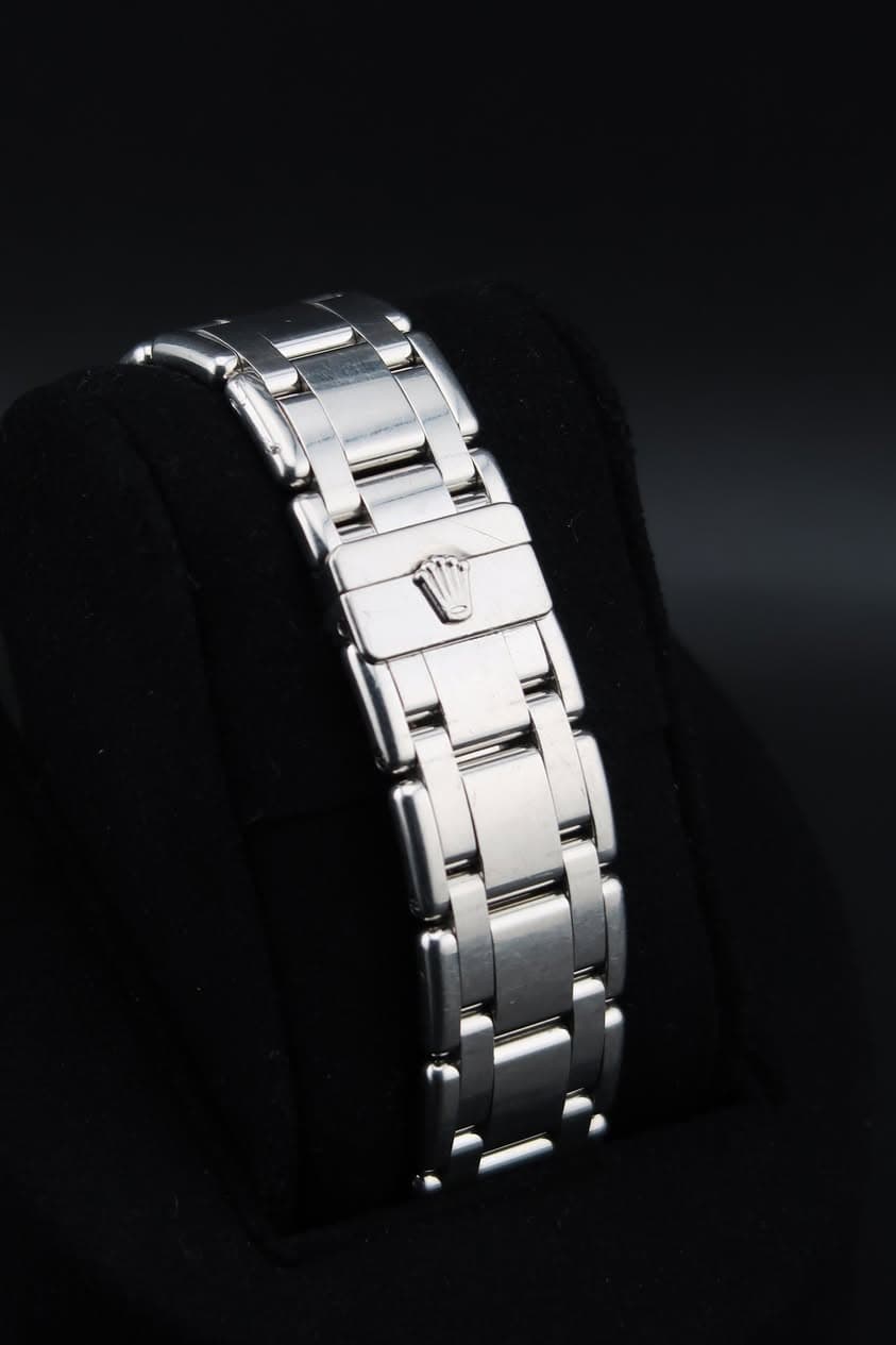 May be an image of jewelry, wrist watch and text