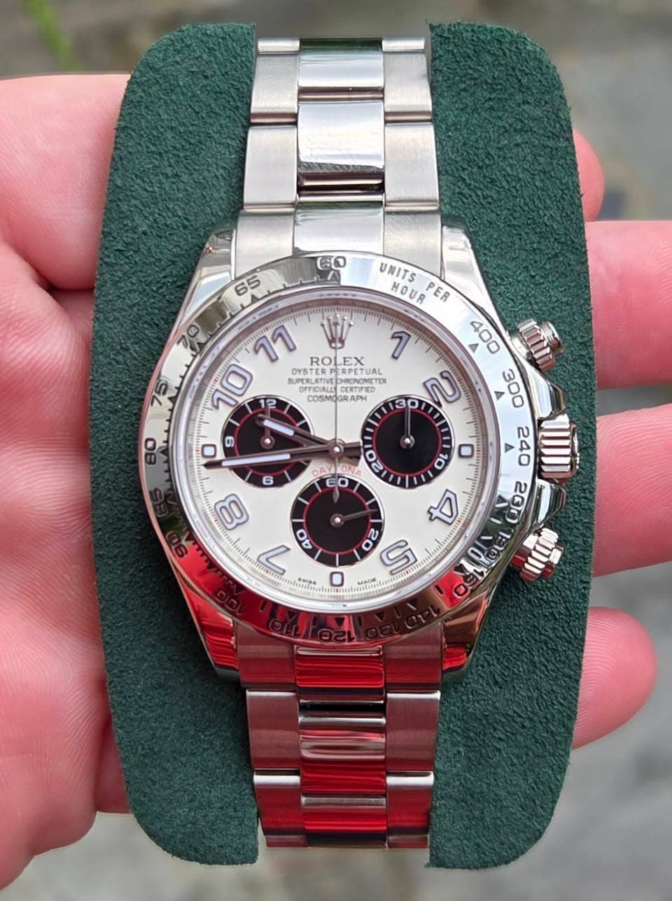 May be an image of wrist watch and text