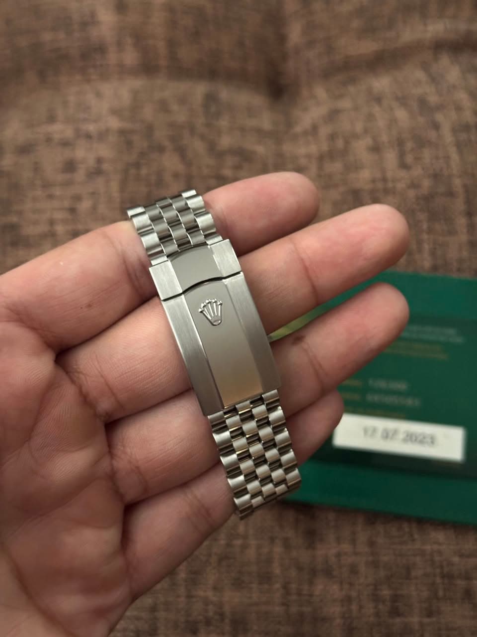 May be an image of wrist watch and text