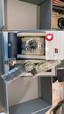 May be an image of wrist watch and text