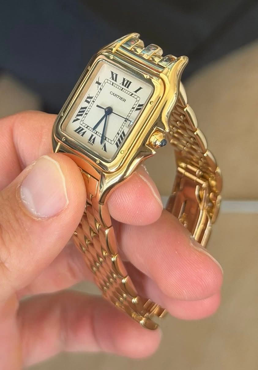 May be an image of wrist watch and text