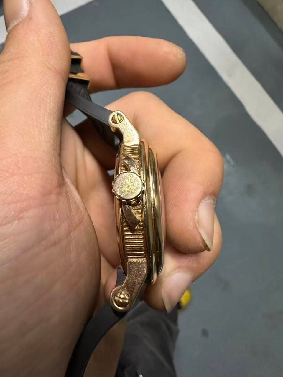 May be an image of wrist watch and brass