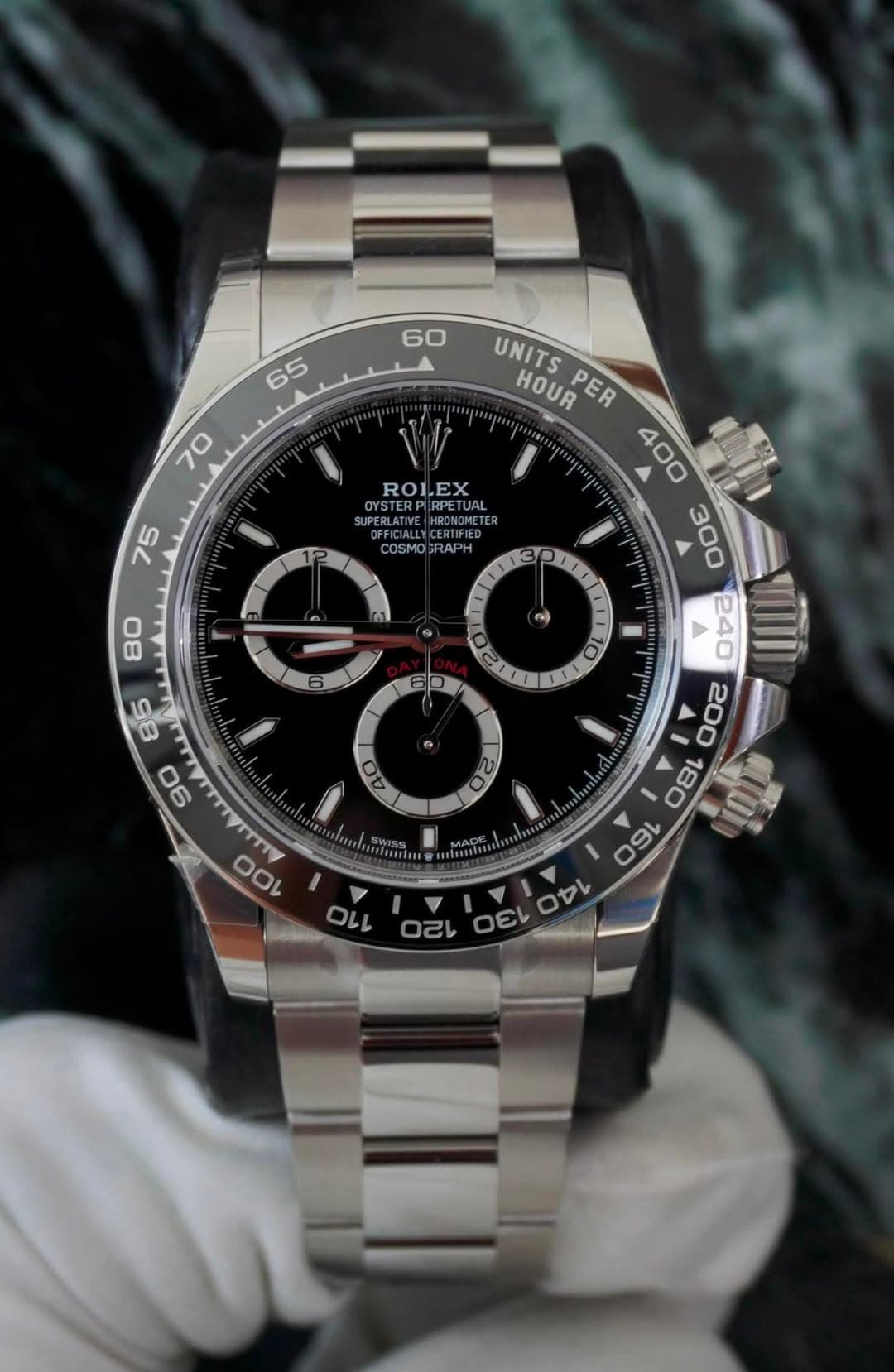 May be an image of wrist watch and text that says '60 65 70 ROLEX A OYSTERPIRPE PIRPETU RPETGAL SUPERLAII OMETER 75 COSMO COSMOGRAPH GRAPH 80 1 ١ o UNITS HOUR PER たタ VIII 200 18C…