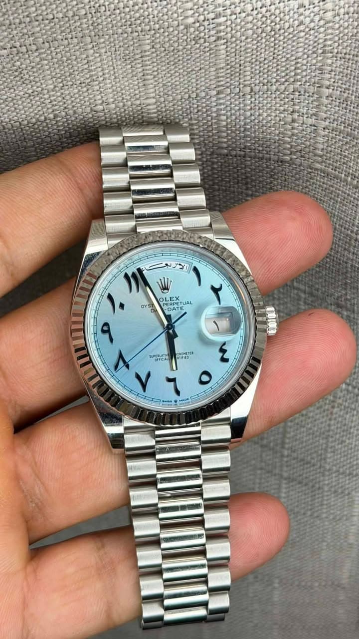 May be an image of wrist watch and text
