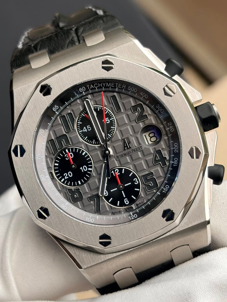 May be an image of wrist watch and text