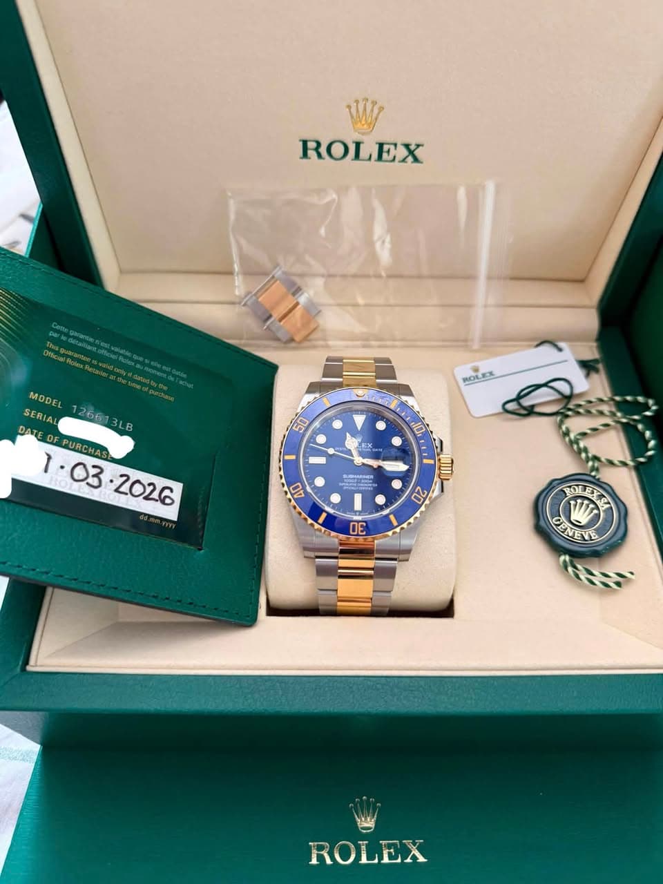 May be an image of wrist watch and text that says 'ROLEX MODEL SERIA 26613LE 2661 SER LB OFPURCHAS DF ROLEX WOE 50 محد 10, LEX 40 OII 20 E BOLEXE JOER 下 CI EINEVE ROLEX'
