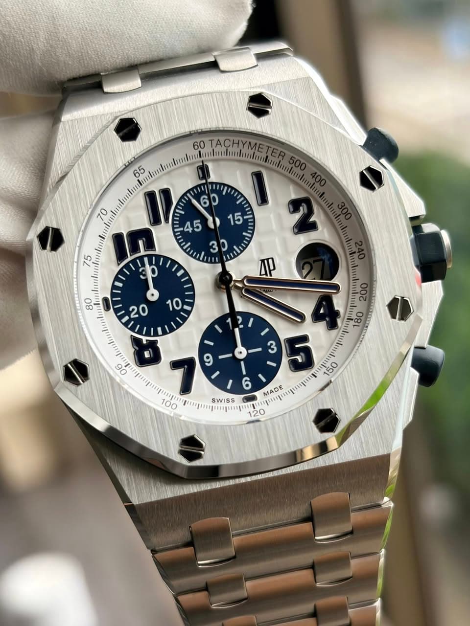May be an image of wrist watch and text