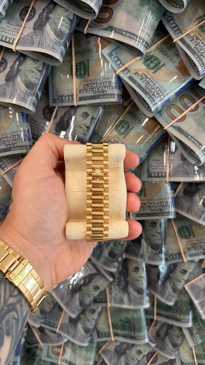 May be an image of wrist watch, money and text
