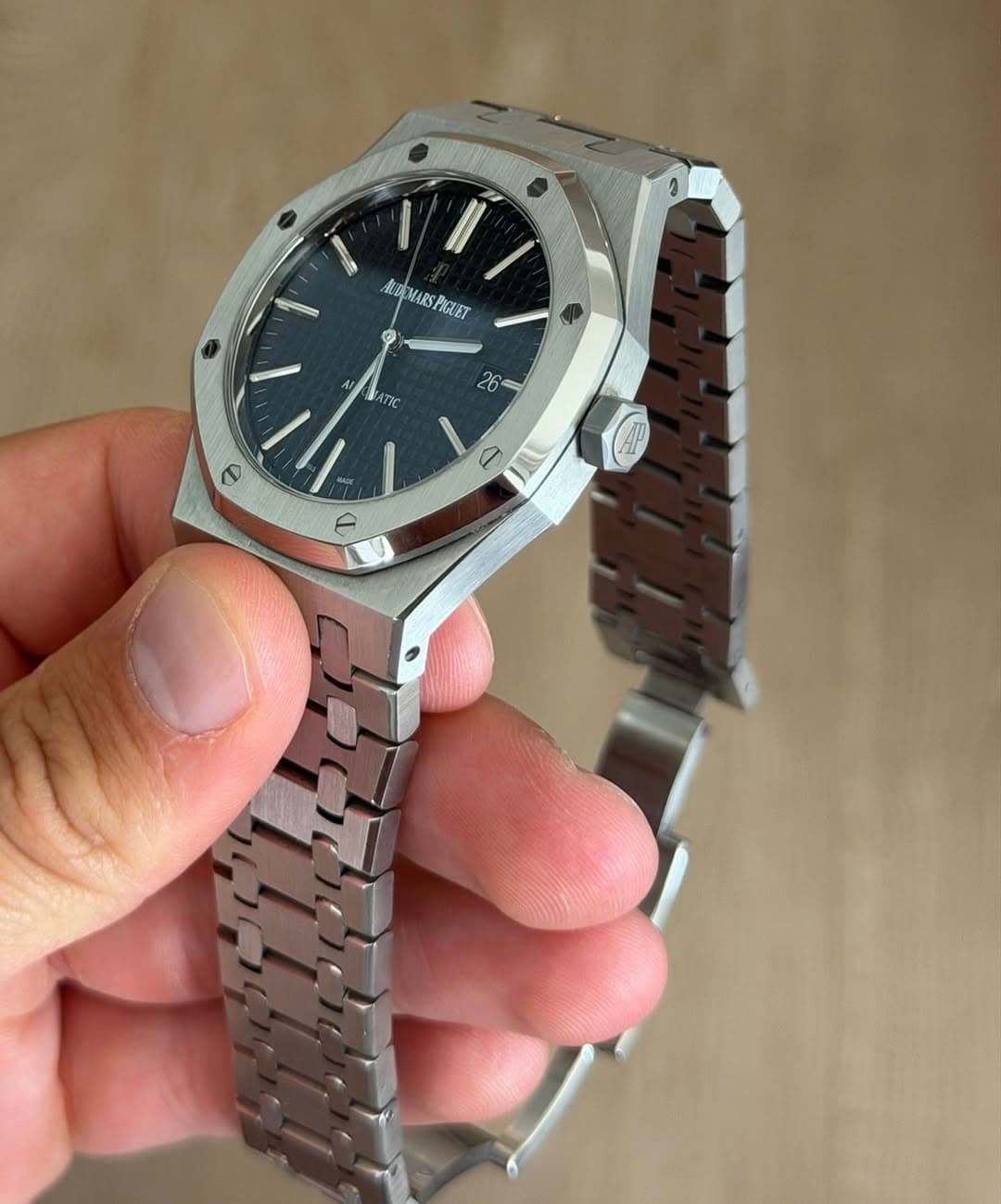 May be an image of wrist watch and text