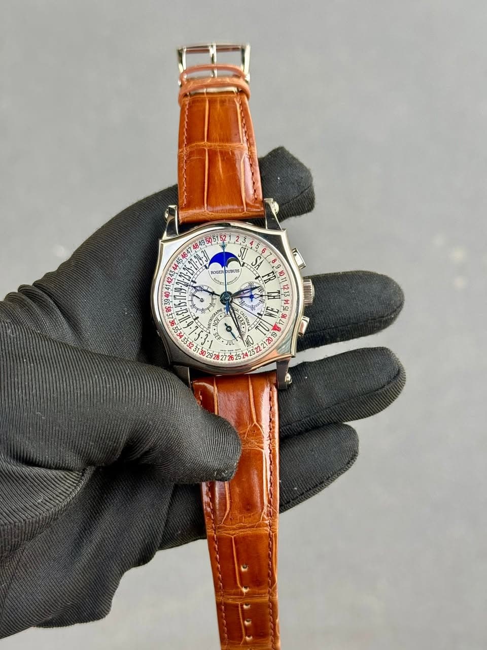 May be an image of wrist watch and text