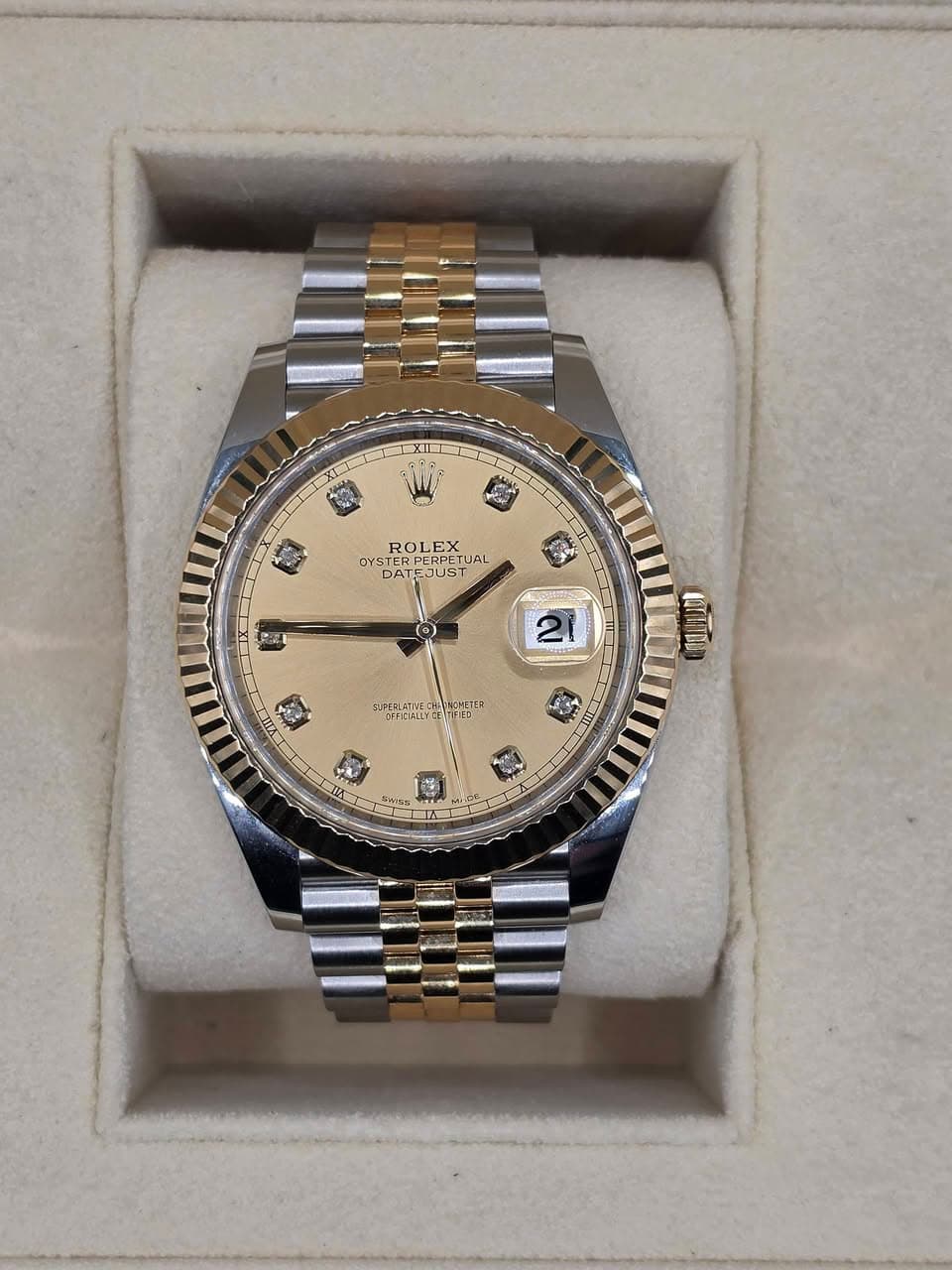 May be an image of wrist watch and text