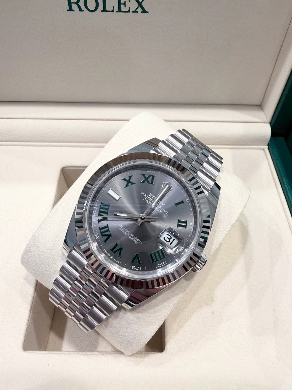May be an image of wrist watch and text