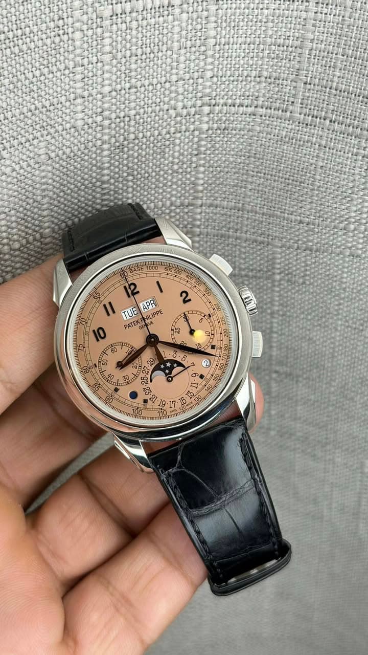 May be an image of wrist watch and text that says '11 APR 2 2 TUE PATEK PATEKPHILIPPE HILIPPE 0 60 50 G EREL E NG -'