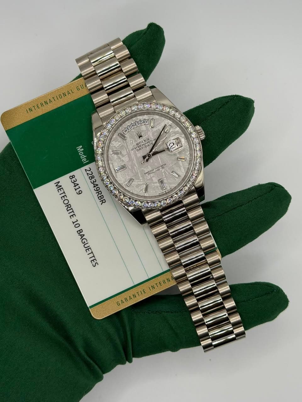 May be an image of wrist watch and text that says 'INTERNATIONALG GU WEDNESDAN WEDNESDAY 0 D ROLEX O視で ن 者 8 αή 0 ม 4 Model METEORITE 228349RBR D B 10BAGUETTES 10 BAGUETTES…