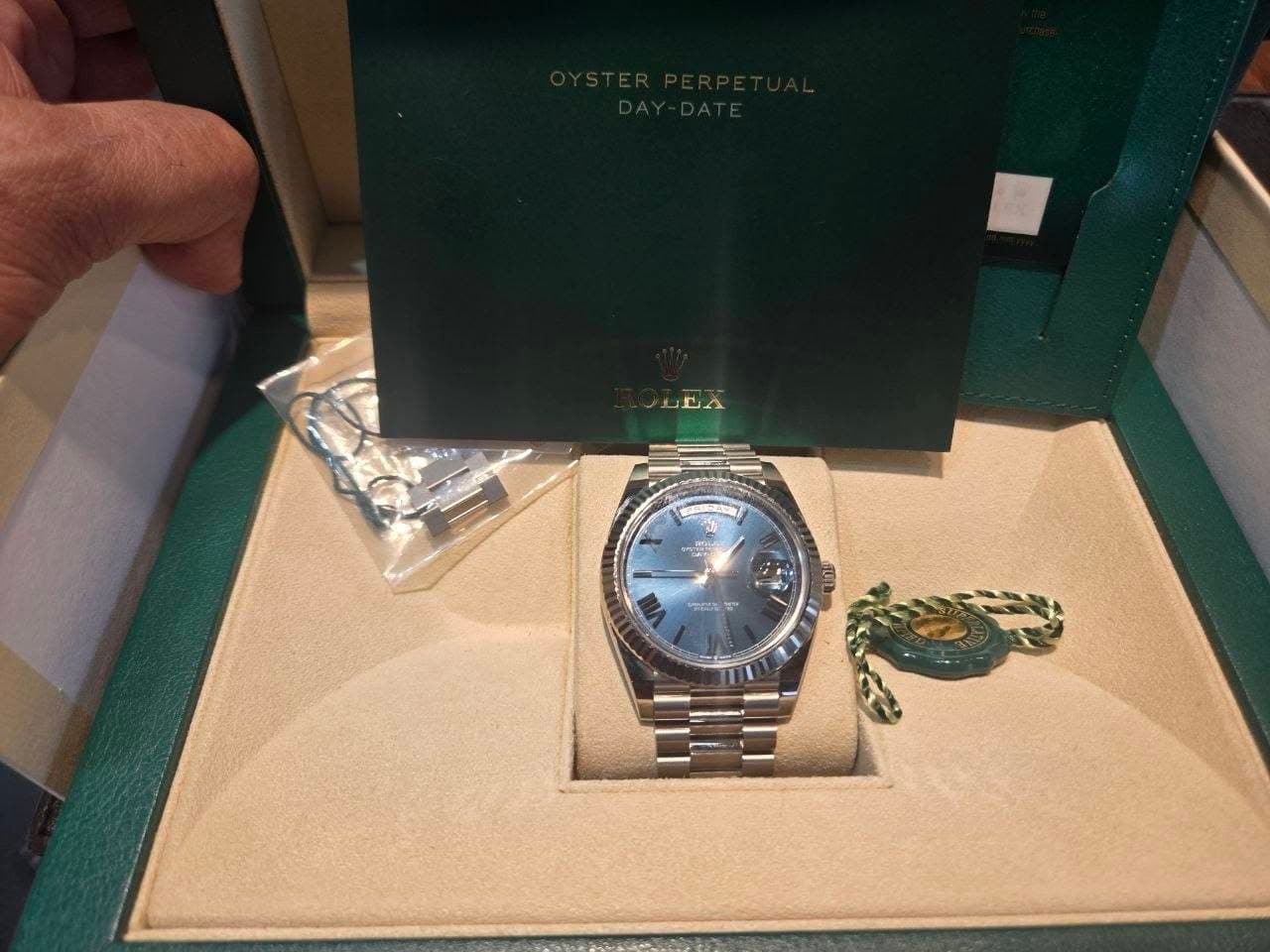 May be an image of wrist watch and text