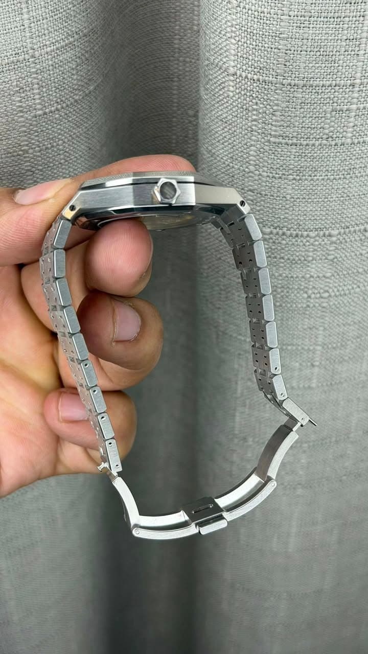 May be an image of wrist watch