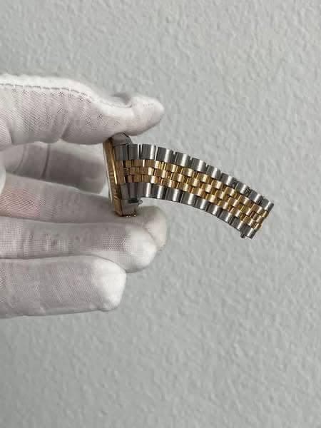 May be an image of wrist watch