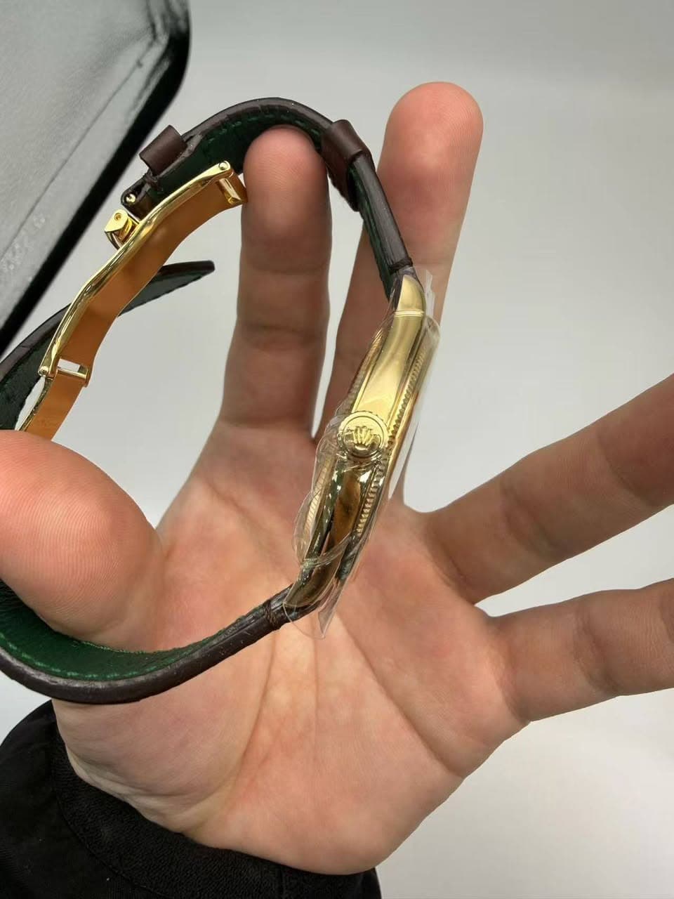 May be an image of eyewear, brass and wrist watch